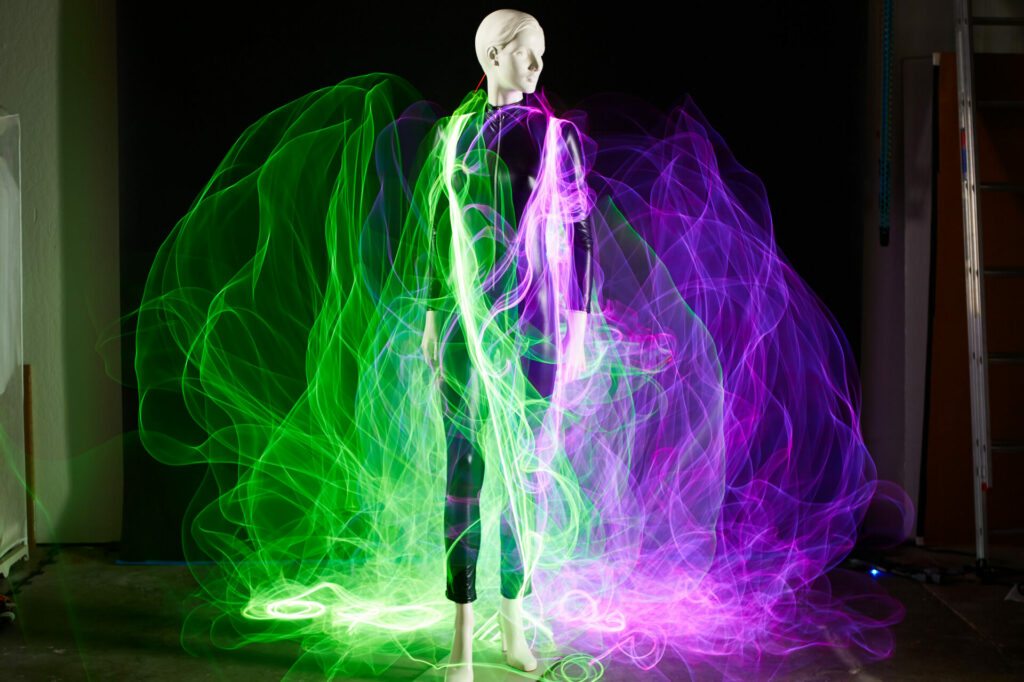 Long exposure image utilizing light painting to create a cape of light